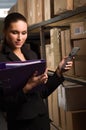 Woman stock counting in warehouse Royalty Free Stock Photo