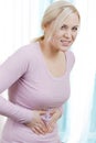 Woman with stomach pain Royalty Free Stock Photo