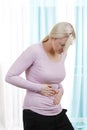 Woman with stomach pain Royalty Free Stock Photo