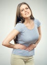 Woman with stomach pain touching tummy. Royalty Free Stock Photo