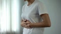 Woman with stomach pain touching tummy, suffering from gastritis, pancreatitis Royalty Free Stock Photo