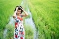 The woman stood tense and the hand held her hair in the meadow