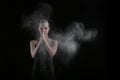 Woman With Stop Motion of Explosive Powder Captured by Flash