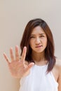 Woman with stop, reject, refuse, forbid, negative hand sign