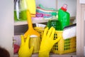 Woman storing cleaning tools in pantry