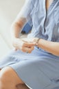 Woman straightens a bracelet on her hand, closeup