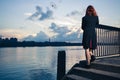 Woman stranding on stairs by river Royalty Free Stock Photo