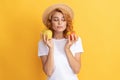 woman in straw hat eating healthy food. youth health. natural organic fresh apple Royalty Free Stock Photo