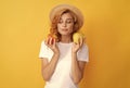 woman in straw hat eating healthy food. youth health. natural organic fresh apple Royalty Free Stock Photo