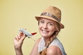 Woman in straw hat holding airplane model in hand Royalty Free Stock Photo