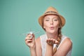 Woman in straw hat holding airplane model in hand Royalty Free Stock Photo