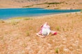 Woman in straw hat lying on dry grass Royalty Free Stock Photo