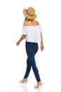 Woman In Straw Hat Walking Rear View Isolated Royalty Free Stock Photo