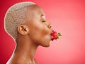 Woman, strawberry and studio for beauty, profile and skincare for wellness, health and diet by red background. African