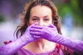 Woman on the street covering her mouth with her hands Royalty Free Stock Photo