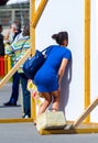 Woman in street photo board, Espinho, Portugal Royalty Free Stock Photo