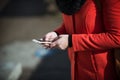 Woman in the street texting with her mobile