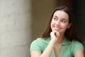 Woman in the street thinking looking at side Royalty Free Stock Photo