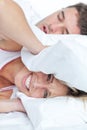 Woman stressed by her boyfriend's snores Royalty Free Stock Photo