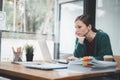 Woman stressed while working on laptop, Tired businesswoman with headache at office, feeling sick at work, Royalty Free Stock Photo