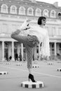 Woman stretch leg on square in paris, france Royalty Free Stock Photo