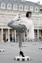 Woman stretch leg on square in paris, france Royalty Free Stock Photo