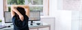 Woman Stretches At Office Desk Chair While