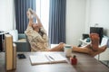 Woman stretching arm and hand during reading book Royalty Free Stock Photo