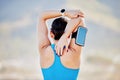 Woman, stretching arms and back view in outdoor for fitness track on smartphone and healthcare exercise. Cardio training Royalty Free Stock Photo