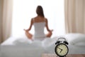 Woman stretching in bed after wake up, back view, entering a day happy and relaxed after good night sleep. Sweet dreams