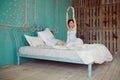 Woman stretching in bed after wake up Royalty Free Stock Photo