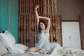 Woman stretching in bed after wake up Royalty Free Stock Photo