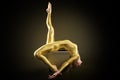 Woman stretching Body, Pilates Exercise. Back bend Yoga Pose. Sporty Gymnast perform on box in Gold Suit Royalty Free Stock Photo