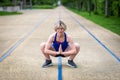 Woman stretching hips and adductors in a squat position Royalty Free Stock Photo