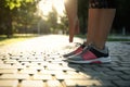 Woman stretching before morning run in park, closeup. Space for text Royalty Free Stock Photo