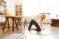 Woman stretching in room at home. Healthy and sport lifestyle. Fitness sport girl doing yoga fitness exercise. Royalty Free Stock Photo