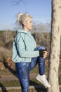 woman stretching before running outdoors Royalty Free Stock Photo