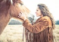 Woman stroking horse Royalty Free Stock Photo