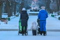 A woman with a stroller in the city at winter Royalty Free Stock Photo