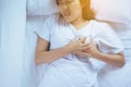 Woman with strong chest pain and hands touching her chest,Heart attack sympto Royalty Free Stock Photo