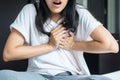 Woman with strong chest pain and hands touching her chest,Heart attack symptom Royalty Free Stock Photo