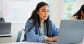 Woman, student and laptop for classroom education, e learning and studying or research in college. Young people typing Royalty Free Stock Photo