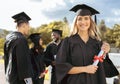 Woman, student and portrait smile for graduation, ceremony or achievement in higher education. Happy female academic Royalty Free Stock Photo