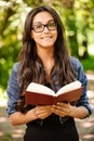 Woman-student reads textbook