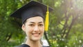 Woman student smiles and feel happy in graduation gowns and cap Royalty Free Stock Photo