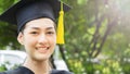 Woman student smiles and feel happy in graduation gowns and cap Royalty Free Stock Photo