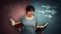 Student choosing book to read Royalty Free Stock Photo