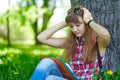 Woman student teenager woman clasped her hands behind her head. Fright, fear. Emotions when preparing for exams