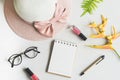 Woman stuff, makeup, flower with empty notepad