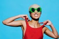 Sunglasses woman trendy fashion summer smile beauty hat swimsuit portrait happy blue Royalty Free Stock Photo